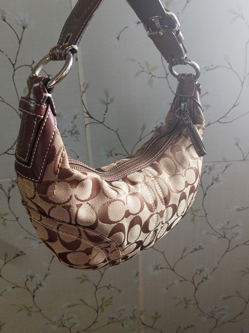 Coach Cute y2k Hobo Bag (Small) (Category: Shoulder Bags) located in Makati City. Submitted by makati_metro (Listing ID 1469264005, Image 3). Description: All details are already posted. In great vintage condition for a 20-year-old bag. Kindly check all photos to appreciate its condition. Please message only if you’ve decided to purchase. Thank you for understanding. Location: Makati MOP: BPi Inclusion: Bag w/ its original hang tag.