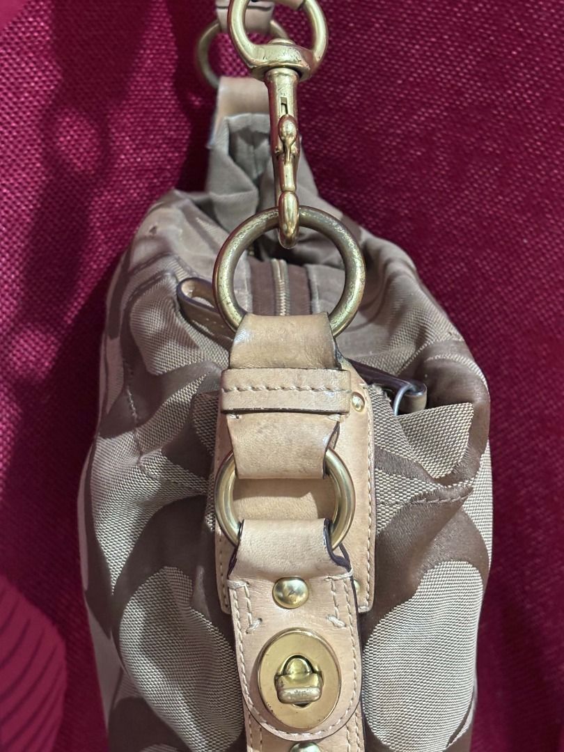Coach Carly Small (Category: Luxury Bags & Wallets) located in Caloocan City. Submitted by classicurations (Listing ID 1469287934, Image 3). Description: my coach signature carly hobo bag 🤎 a classic y2k coach piece featuring the iconic brown and beige signature jacquard canvas, tan leather trim, and beautiful brass hardware. the perfect everyday shoulder bag with that effortlessly vintage look that goes with almost anything. such a timeless pie