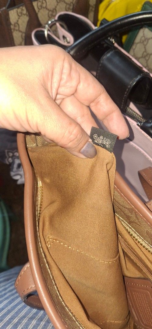 Coach Signature Monogram Tote Bag Brown (Category: Luxury Bags & Wallets) located in General Santos City (Dadiangas). Submitted by joytayaba (Listing ID 1469200115, Image 3). Description: - Brand: Coach - Style: Signature monogram tote bag - Color: Classic brown canvas with tan leather straps and trim - Hardware: Gold-tone - Closure: Secure top zip - Interior: Brown fabric lining with multi-compartments and Coach creed patch - Capacity: Roomy eve
