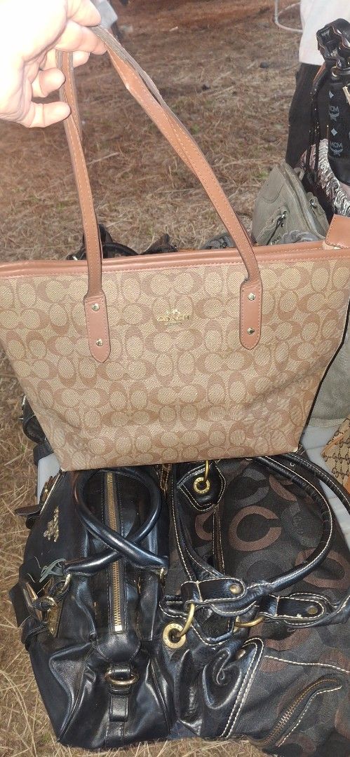 Coach Signature Monogram Tote Bag Brown (Category: Luxury Bags & Wallets) located in General Santos City (Dadiangas). Submitted by joytayaba (Listing ID 1469200115, Image 1). Description: - Brand: Coach - Style: Signature monogram tote bag - Color: Classic brown canvas with tan leather straps and trim - Hardware: Gold-tone - Closure: Secure top zip - Interior: Brown fabric lining with multi-compartments and Coach creed patch - Capacity: Roomy eve