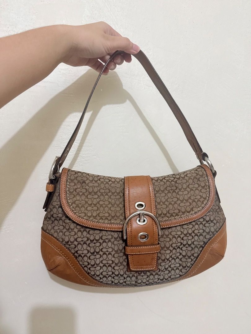 Vintage Coach Soho Jacquard Tan- Medium (Category: Luxury Bags & Wallets) located in Pasig City. Submitted by romaca015 (Listing ID 1469336787, Image 1). Description: Decluttering. PM Sure Buyer Vintage Coach Canvas Buckle Shoulder Bag Body and leather, no rubs, no holes, clean inner. Only issue, leather has its own character of spots or freckles. Already used saddle soap and leather con. I guess its part of its style na, bag is still very goodly