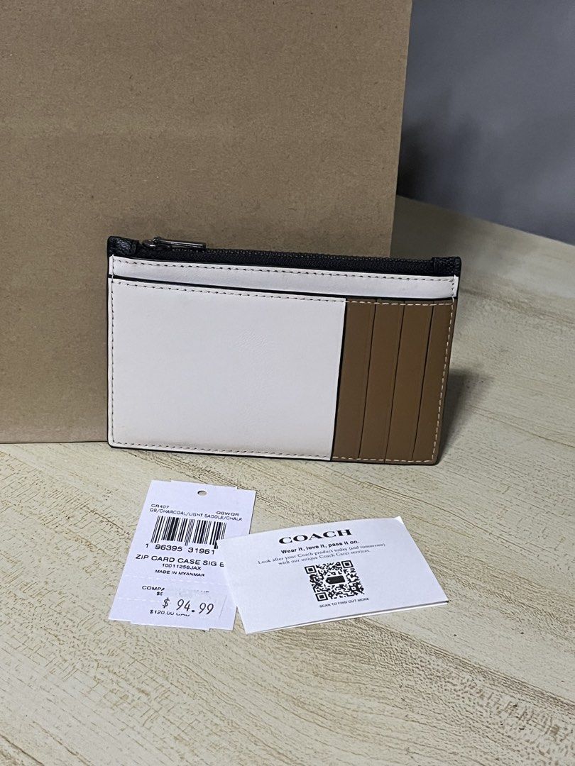 Coach Zip Card Case (Category: Wallets & Card Holders) located in Quezon City. Submitted by azarels (Listing ID 1469303143, Image 2). Description: Stored but brand new Still with tag, paperbag and care card It’s just one item po, front and back yung photo. Authentic bought in US 🇺🇸 Fixed price (Please don’t ask for last price) 📍Quezon City.