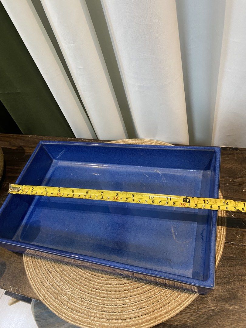 Cobalt Blue Ceramic Rectangular Tray Dish (Category: Dinnerware & Cutlery) located in San Pedro. Submitted by jingay81 (Listing ID 1469375418, Image 3). Description: - Color: Striking cobalt blue with a glossy glaze finish - Material: Solid, heavy-duty ceramic that sits flat on surfaces - Dimensions: Roughly 14 inches long and 2 inches deep with high walls - Versatile use: Ideal catch-all for entryway keys, mail, trinkets, or as a stylish home de