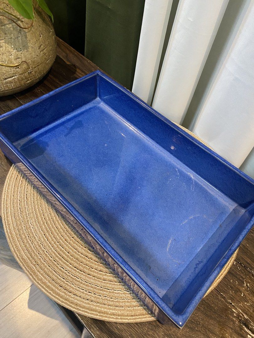 Cobalt Blue Ceramic Rectangular Tray Dish (Category: Dinnerware & Cutlery) located in San Pedro. Submitted by jingay81 (Listing ID 1469375418, Image 2). Description: - Color: Striking cobalt blue with a glossy glaze finish - Material: Solid, heavy-duty ceramic that sits flat on surfaces - Dimensions: Roughly 14 inches long and 2 inches deep with high walls - Versatile use: Ideal catch-all for entryway keys, mail, trinkets, or as a stylish home de