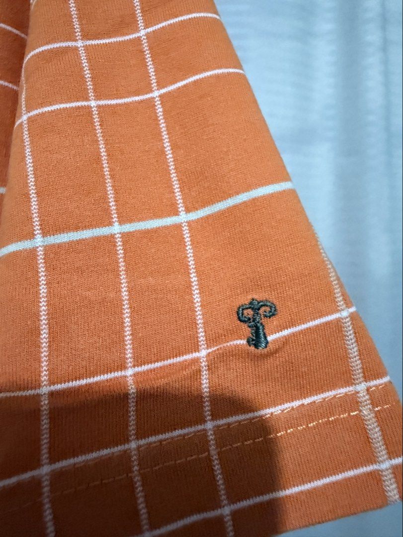 Collezione C2 Polo Shirt (Category: Tshirts & Polo Shirts ) located in Manila. Submitted by clothesandcollectibles (Listing ID 1469354190, Image 3). Description: Collezione C2, Features a vibrant orange base with a clean, modern white windowpane grid/check pattern..