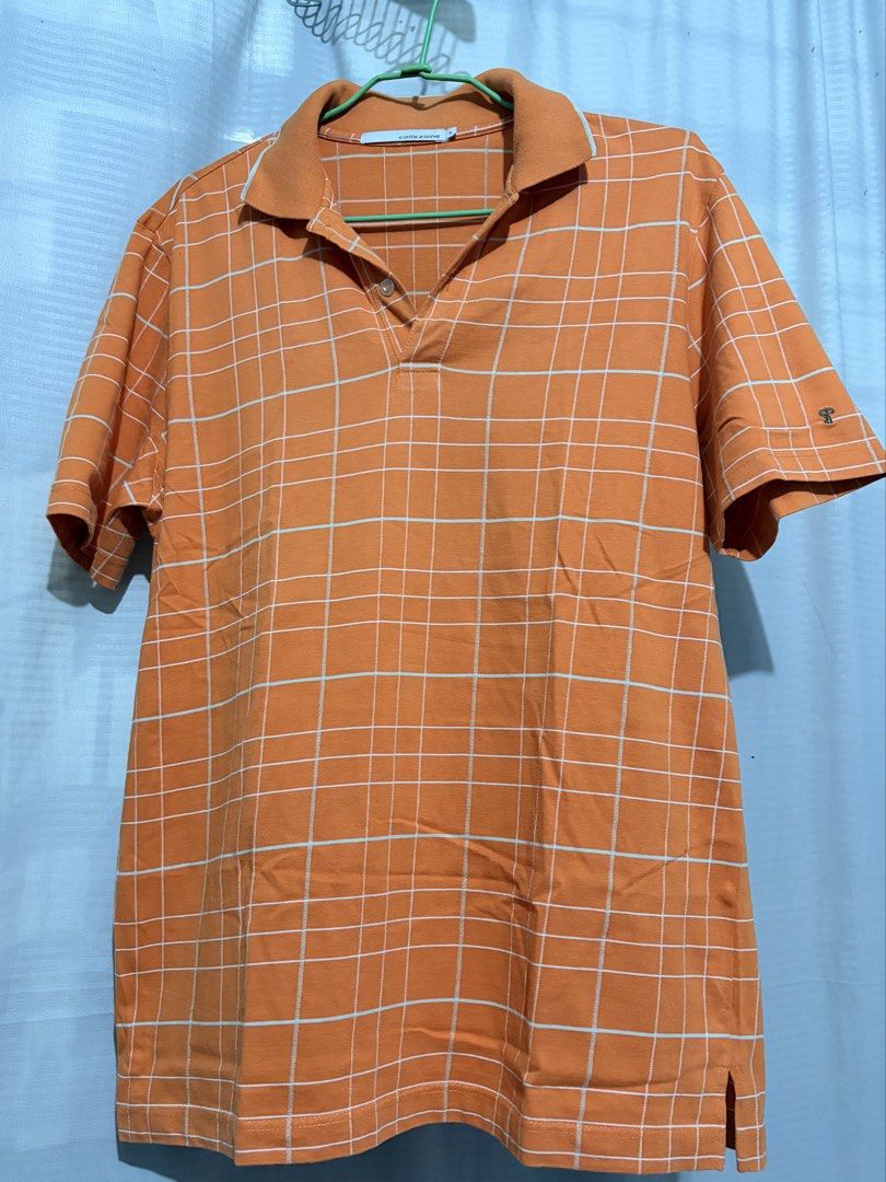 Collezione C2 Polo Shirt (Category: Tshirts & Polo Shirts ) located in Manila. Submitted by clothesandcollectibles (Listing ID 1469354190, Image 1). Description: Collezione C2, Features a vibrant orange base with a clean, modern white windowpane grid/check pattern..