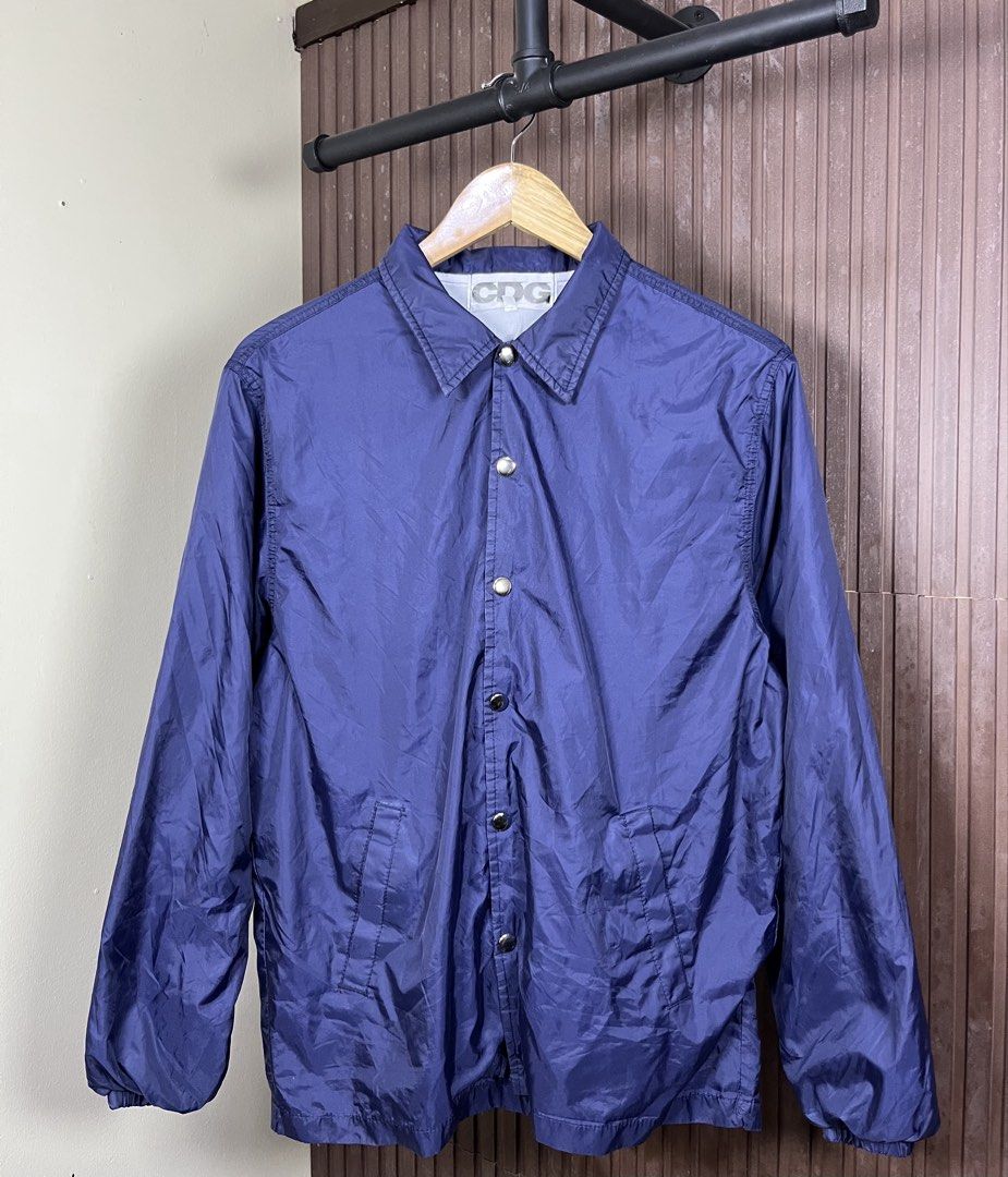 Comme des Garcons CDG Coach Jacket (Category: Coats, Jackets and Outerwear) located in Cabanatuan. Submitted by cabsygoods (Listing ID 1469165123, Image 1). Description: Comme des Garcons CDG Coach Jacket Authentic Width: 20.5 Length: 26.5 (Inches) Very good condition Issue scratches on print Color rate 9/10 Dm to purchase! 📩.