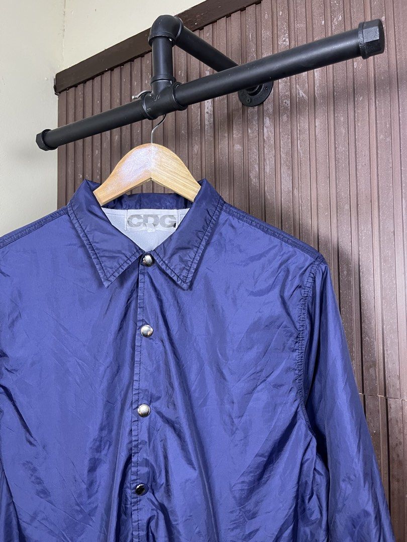 Comme des Garcons CDG Coach Jacket (Category: Coats, Jackets and Outerwear) located in Cabanatuan. Submitted by cabsygoods (Listing ID 1469165123, Image 2). Description: Comme des Garcons CDG Coach Jacket Authentic Width: 20.5 Length: 26.5 (Inches) Very good condition Issue scratches on print Color rate 9/10 Dm to purchase! 📩.
