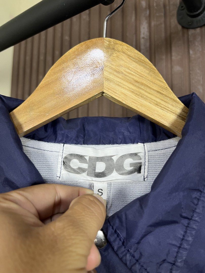 Comme des Garcons CDG Coach Jacket (Category: Coats, Jackets and Outerwear) located in Cabanatuan. Submitted by cabsygoods (Listing ID 1469165123, Image 3). Description: Comme des Garcons CDG Coach Jacket Authentic Width: 20.5 Length: 26.5 (Inches) Very good condition Issue scratches on print Color rate 9/10 Dm to purchase! 📩.