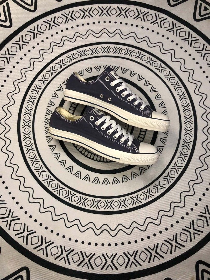 Converse All Star Low Navy Blue 🫶 (Category: Sneakers) located in Manila. Submitted by sonkicks (Listing ID 1469312375, Image 2). Description: Navy blue Converse All Star low-top sneakers. White laces, white rubber toe cap, and classic black-striped midsole. Size US Men's 8.5, Women's 10.5, UK 8.5, EUR 42, 27 cm. Brown rubber outsole with diamond tread pattern. Classic All Star license plate on the heel. Made in Vietnam. Fabric upper and lining.