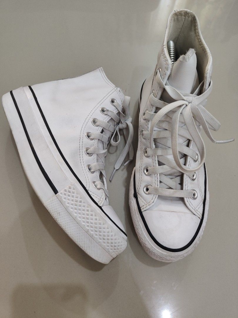 Converse White High Top Platform Sneakers (Category: Sneakers) located in Calamba. Submitted by an_ne0501 (Listing ID 1469210144, Image 1). Description: - Authentic White Converse High Top Platform Sneakers - Thick rubber sole featuring iconic black stripe detail - Classic lace-up front with durable metal eyelets - Uppers are mostly clean with minimal dirt on soles and bottoms - Perfect for daily casual fits and elevating your street style.