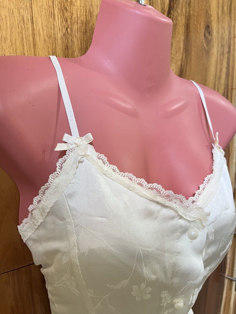 Coquette Cream Sleveless Top (Category: Sleeveless) located in Cabanatuan. Submitted by winx_closeth (Listing ID 1469217789, Image 2). Description: Satin Adjustable straps W/ built in bra Washable stain.