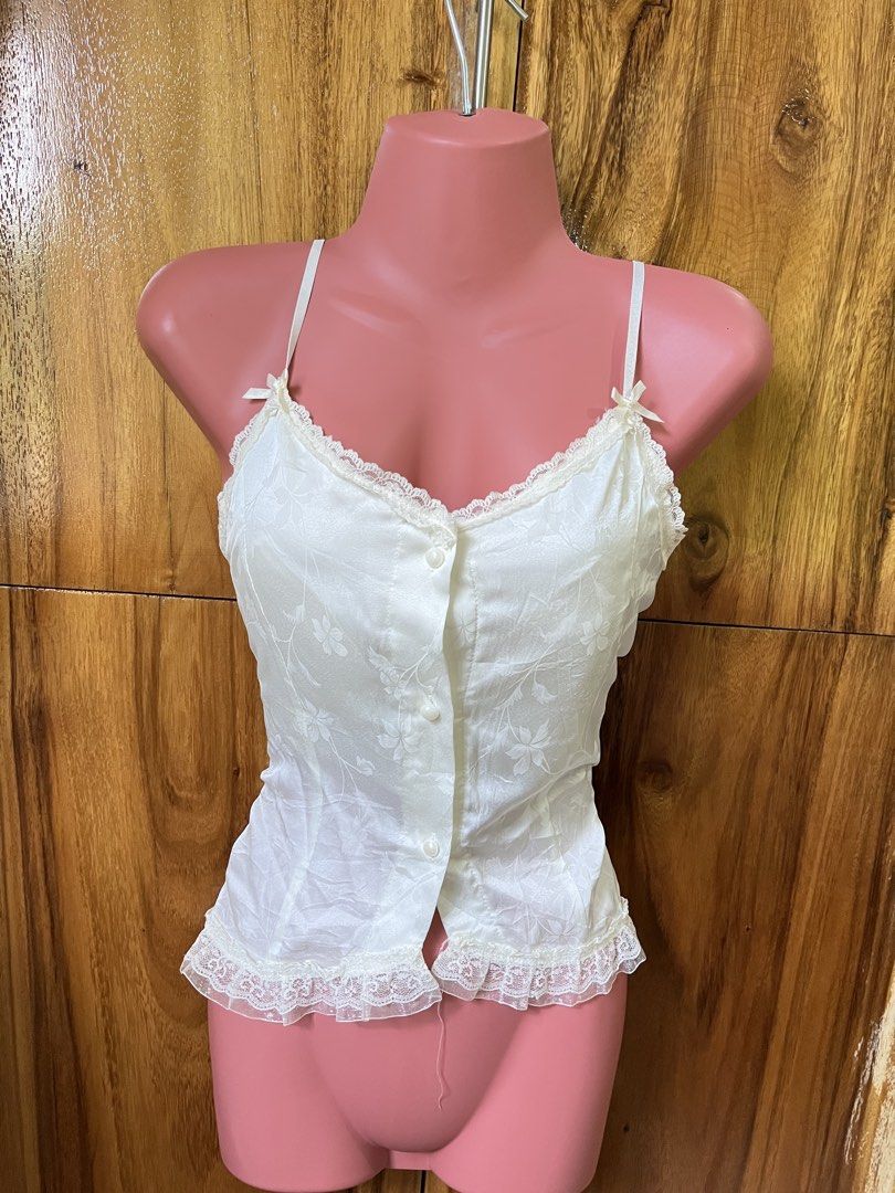 Coquette Cream Sleveless Top (Category: Sleeveless) located in Cabanatuan. Submitted by winx_closeth (Listing ID 1469217789, Image 1). Description: Satin Adjustable straps W/ built in bra Washable stain.