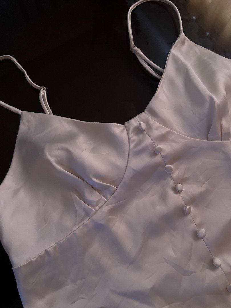Corset Top (Category: Others Tops) located in Manila. Submitted by silver.rae (Listing ID 1469228040, Image 3). Description: satin fabric color beige/cream.