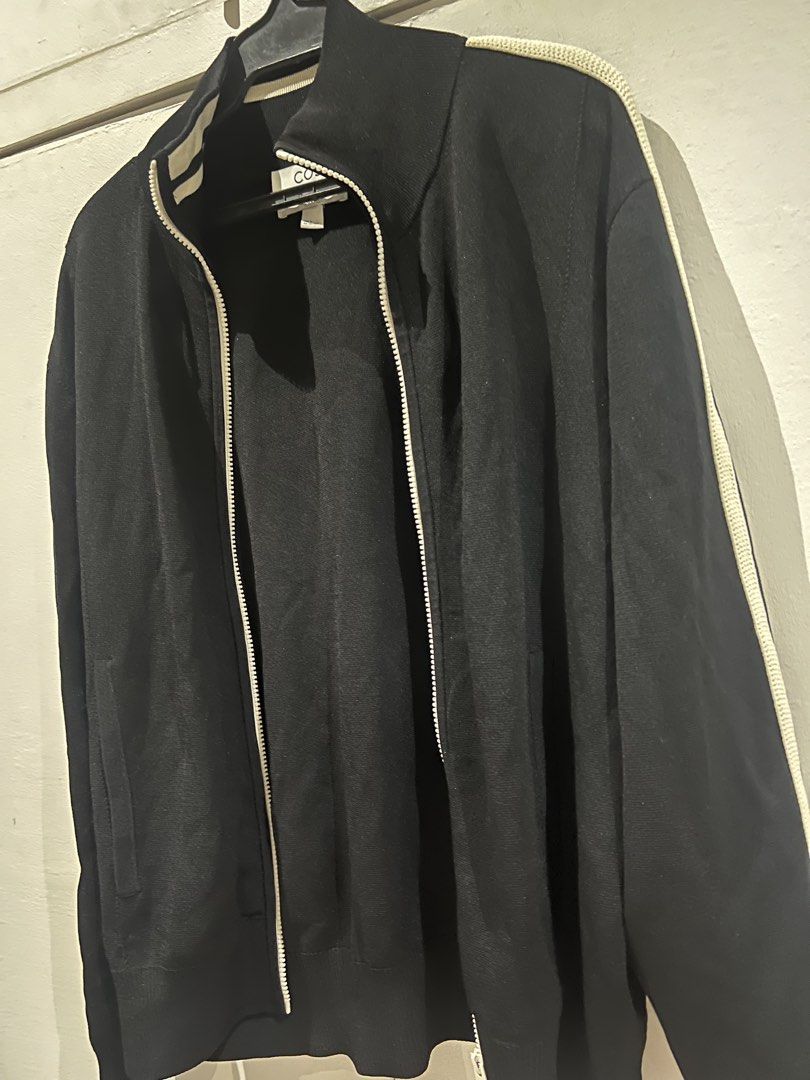 COS Black Regular Fit Zip Up Jacket & Pants Set (Category: Sets & Coordinates) located in Quezon City. Submitted by Zandee (Listing ID 1469306013, Image 3). Description: - Brand/Model: COS black zip-up jacket - Size: EUR M (Regular fit) - Details: Full zip front, ribbed collar/cuffs/hem, knit texture fabric, contrast piping on sleeves, side pockets - Condition: Clean, worn only a few times - Style: Great daily outerwear layer.