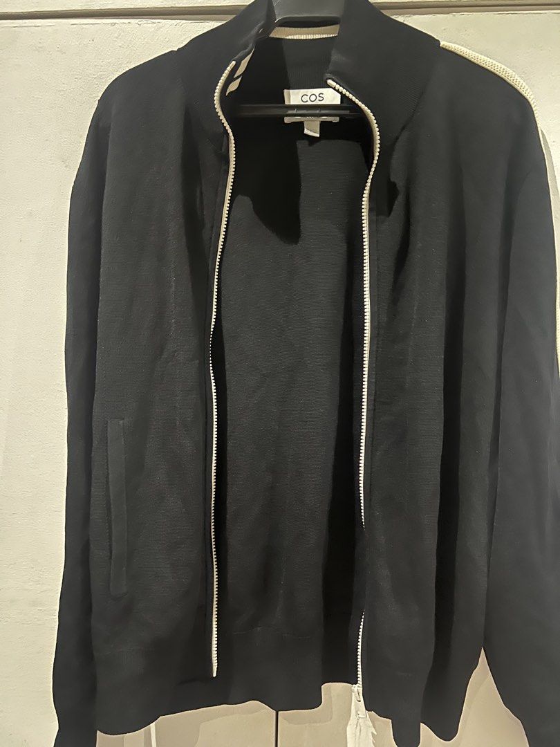 COS Black Regular Fit Zip Up Jacket & Pants Set (Category: Sets & Coordinates) located in Quezon City. Submitted by Zandee (Listing ID 1469306013, Image 1). Description: - Brand/Model: COS black zip-up jacket - Size: EUR M (Regular fit) - Details: Full zip front, ribbed collar/cuffs/hem, knit texture fabric, contrast piping on sleeves, side pockets - Condition: Clean, worn only a few times - Style: Great daily outerwear layer.