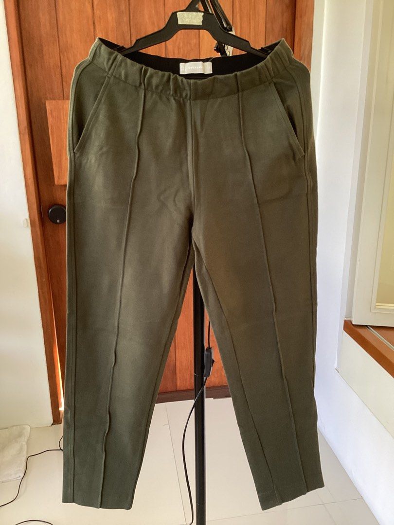 COS Olive Green Trousers EUR 34 (Category: Other Bottoms) located in Bacoor. Submitted by cts217 (Listing ID 1469280511, Image 1). Description: - Brand/Model: COS Trousers - Size: EUR 34 - Color: Olive Green - Material: 100% Polyester - Features: Elastic waistband, front slip pockets, two back welt pockets - Fit: Straight leg cut with center front seam detailing - Condition: Excellent, perfect for daily versatile wear.