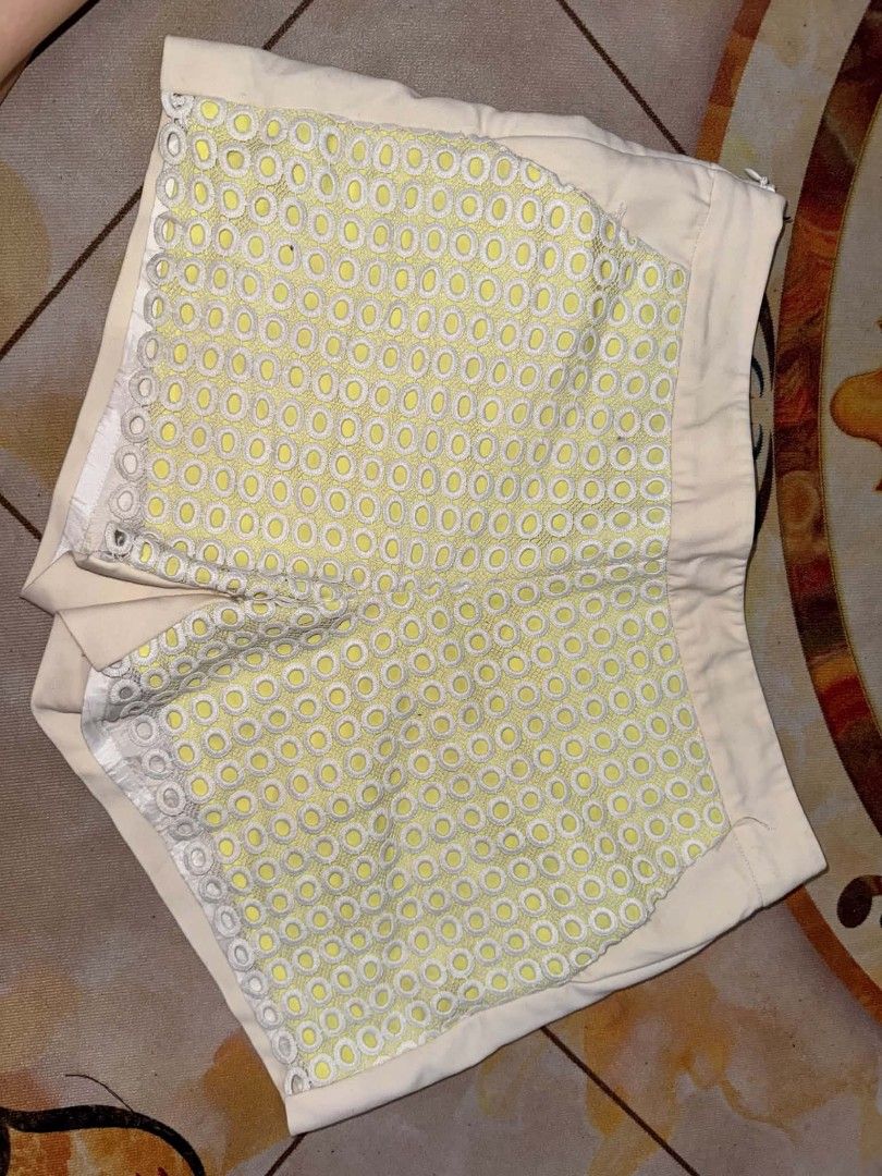 Cream and Yellow Circle Lace Pattern Tailored Shorts (Category: Shorts) located in Caloocan City. Submitted by mylove326 (Listing ID 1469239665, Image 2). Description: - Cream tailored shorts with unique yellow and white round lace overlay panels - Features a clean back with two welt pockets and a structured waistband - Convenient side zipper closure - Length: approximately 12 inches - Great statement piece for warm weather and OOTDs .