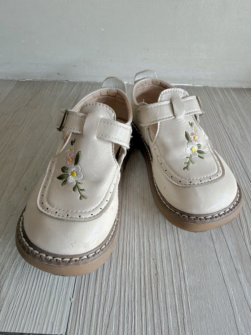Cream Floral Embroidered Shoes (Category: Babies & Kids Fashion) located in Quezon City. Submitted by warmrabbit_414908 (Listing ID 1469163471, Image 1). Description: - Size: 16 cm - Style: Cream leather flats with delicate floral embroidery on the toe box - Closure: Adjustable single strap with bronze buckle - Soles: Sturdy flat rubber soles with stylish contrast stitching - Condition: Worn only a couple of times, soles are very clean with minim