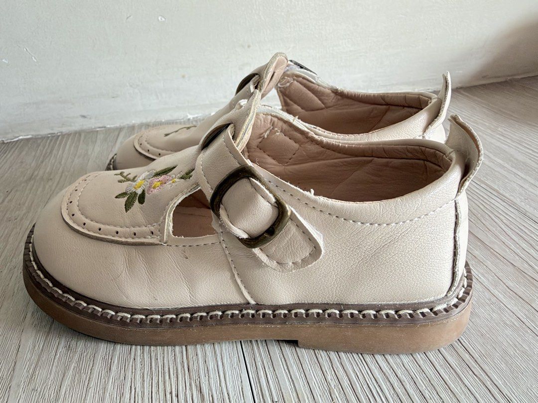 Cream Floral Embroidered Shoes (Category: Babies & Kids Fashion) located in Quezon City. Submitted by warmrabbit_414908 (Listing ID 1469163471, Image 2). Description: - Size: 16 cm - Style: Cream leather flats with delicate floral embroidery on the toe box - Closure: Adjustable single strap with bronze buckle - Soles: Sturdy flat rubber soles with stylish contrast stitching - Condition: Worn only a couple of times, soles are very clean with minim