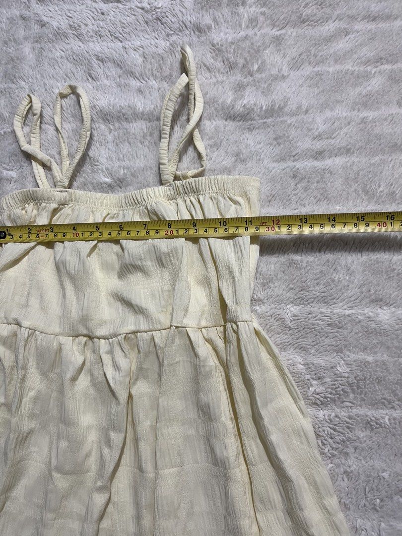 Cream Midi Cami Dress with Textured Pattern (Category: Dresses) located in Manila. Submitted by kiks_secret_room (Listing ID 1469250609, Image 3). Description: - Color: Cream with a textured check pattern - Fit: Relaxed fit with a stretchy smocked bodice - Design: Double straps on each side and a cute tiered skirt - Fabric: Light crinkle texture - Measurements: Pit to pit ~16 inches, Length from waist ~27 inches - Condition: Brand new / Excellent