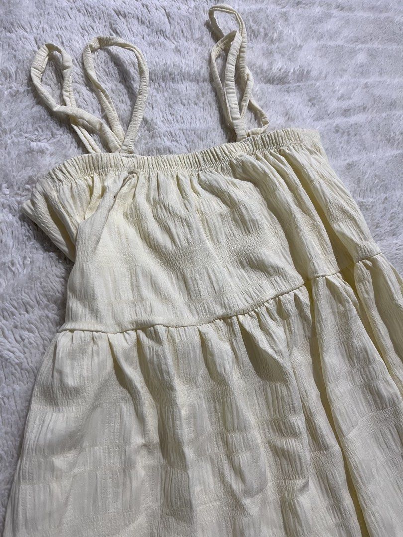 Cream Midi Cami Dress with Textured Pattern (Category: Dresses) located in Manila. Submitted by kiks_secret_room (Listing ID 1469250609, Image 2). Description: - Color: Cream with a textured check pattern - Fit: Relaxed fit with a stretchy smocked bodice - Design: Double straps on each side and a cute tiered skirt - Fabric: Light crinkle texture - Measurements: Pit to pit ~16 inches, Length from waist ~27 inches - Condition: Brand new / Excellent