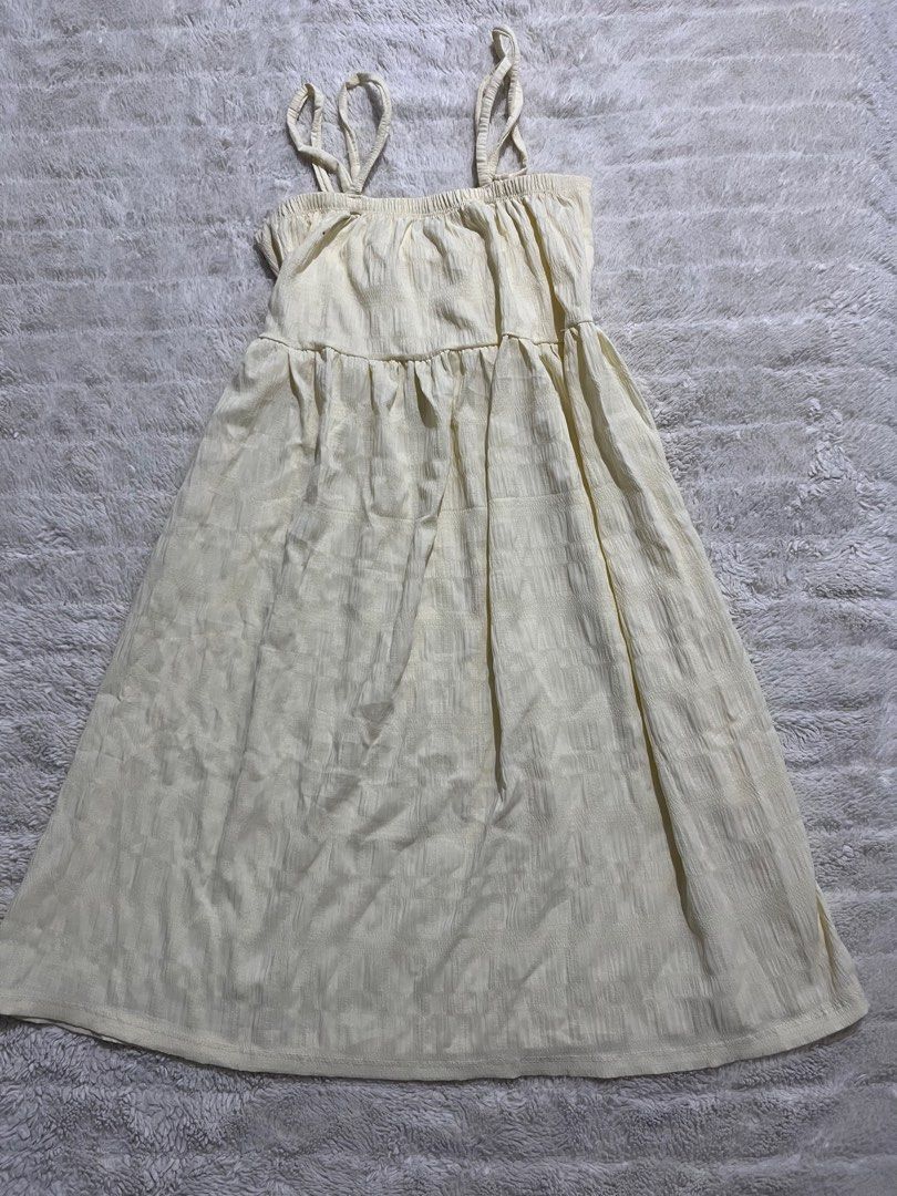 Cream Midi Cami Dress with Textured Pattern (Category: Dresses) located in Manila. Submitted by kiks_secret_room (Listing ID 1469250609, Image 1). Description: - Color: Cream with a textured check pattern - Fit: Relaxed fit with a stretchy smocked bodice - Design: Double straps on each side and a cute tiered skirt - Fabric: Light crinkle texture - Measurements: Pit to pit ~16 inches, Length from waist ~27 inches - Condition: Brand new / Excellent