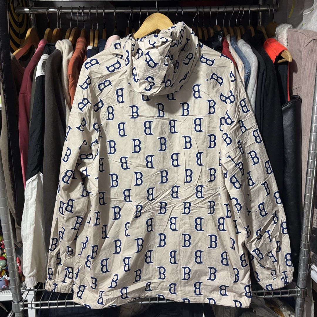 Cream Monogram Print Hooded Jacket (Category: Coats, Jackets and Outerwear) located in Caloocan City. Submitted by bonsatocha43876 (Listing ID 1469321994, Image 2). Description: - Color/Design: Cream with all-over blue letter print - Closure: Full front zip with dual zippered side pockets - Features: Adjustable hood, elasticated cuffs, and lightweight material - Size: 25 inches width x 29 inches length - Condition/Style: Easy to throw on for casu
