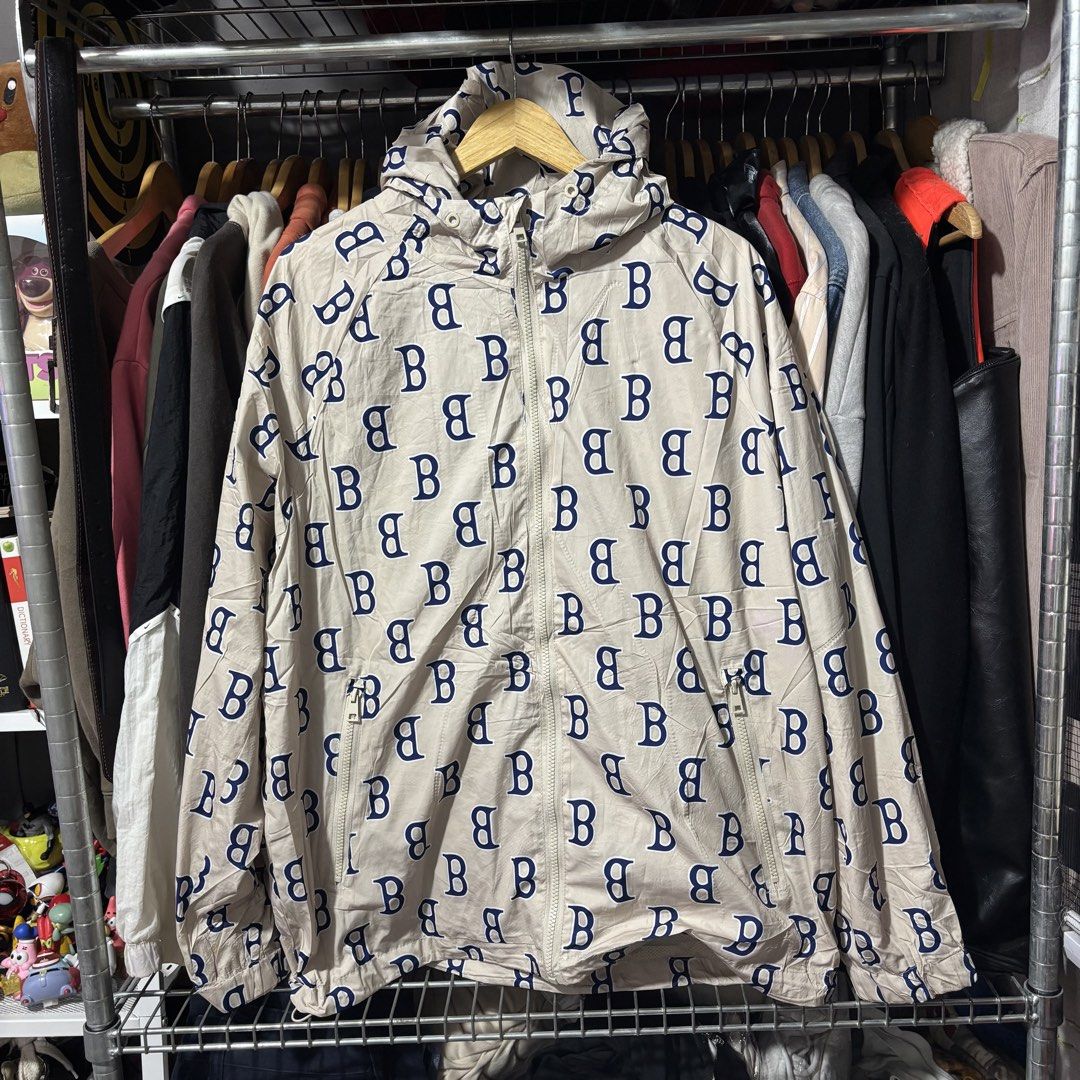 Cream Monogram Print Hooded Jacket (Category: Coats, Jackets and Outerwear) located in Caloocan City. Submitted by bonsatocha43876 (Listing ID 1469321994, Image 3). Description: - Color/Design: Cream with all-over blue letter print - Closure: Full front zip with dual zippered side pockets - Features: Adjustable hood, elasticated cuffs, and lightweight material - Size: 25 inches width x 29 inches length - Condition/Style: Easy to throw on for casu