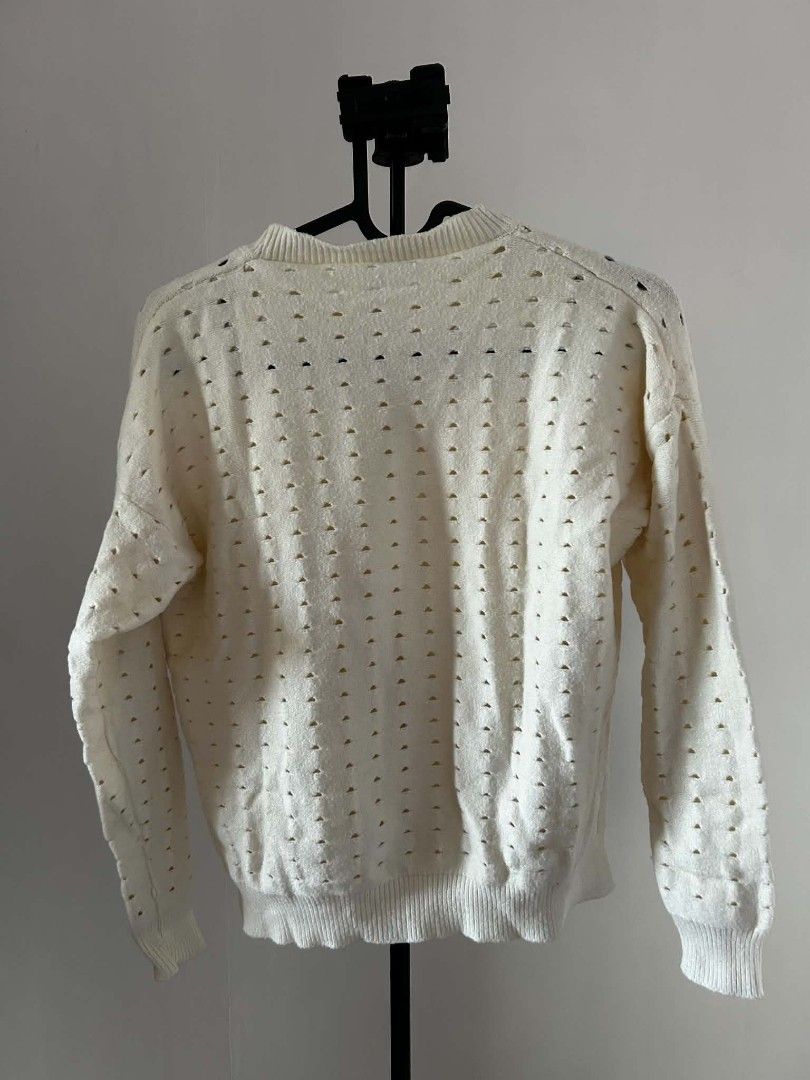 Cream White Open Knit Crewneck Sweater (Category: Coats, Jackets and Outerwear) located in Carmona. Submitted by av067t (Listing ID 1469162681, Image 2). Description: - Color: Cream white - Material: Thick knit fabric with open hole pattern details - Design: Ribbed crewneck, cuffs, hem, and trendy side slits - Size: Best fits XS to S - Measurements (laid flat): Width 19" | Length 17.5" | Sleeve Length 5.5".