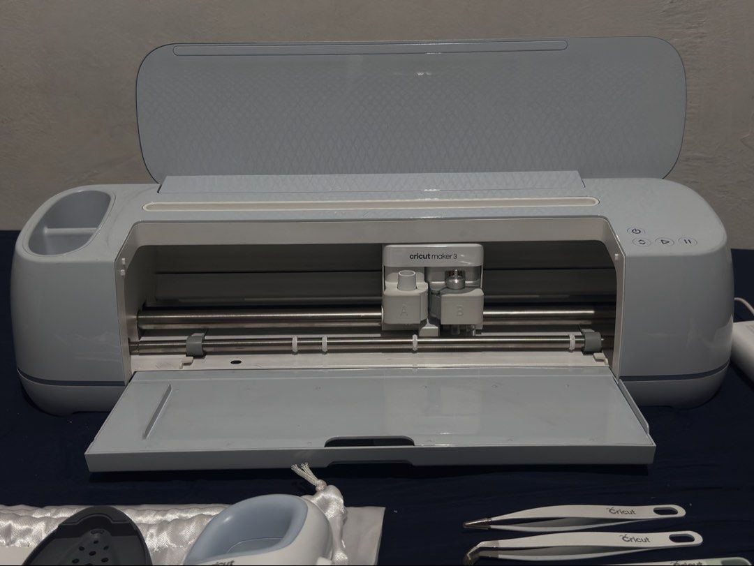 Cricut Maker 3 Bundle with EasyPress Mini and Tools (Category: Craft Supplies & Tools) located in Manila. Submitted by royalfox.68af7c (Listing ID 1469239970, Image 2). Description: Cricut Maker 3 electronic cutting machine bundled with the Cricut EasyPress Mini. Includes power cords, instruction manual, storage pouch, plus a set of five weeding tools and tweezers. Light blue colorway. Clean condition, everything laid out ready for crafting..