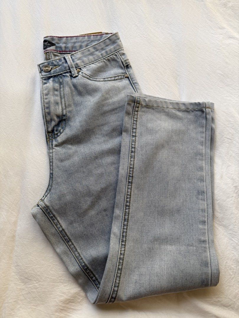 Crissa High Waist Denim Jeans (Category: Jeans) located in Manila. Submitted by the.prelovedcloset (Listing ID 1469254802, Image 3). Description: - Brand: Crissa - Size: Fits 24-26 - Style: High-waist, straight-leg denim - Wash: Light wash with a soft faded effect - Details: Classic five-pocket design, button fly closure, belt loops, and a vintage '1983' tan leather back patch - Condition: Excellent, comfortable fit.