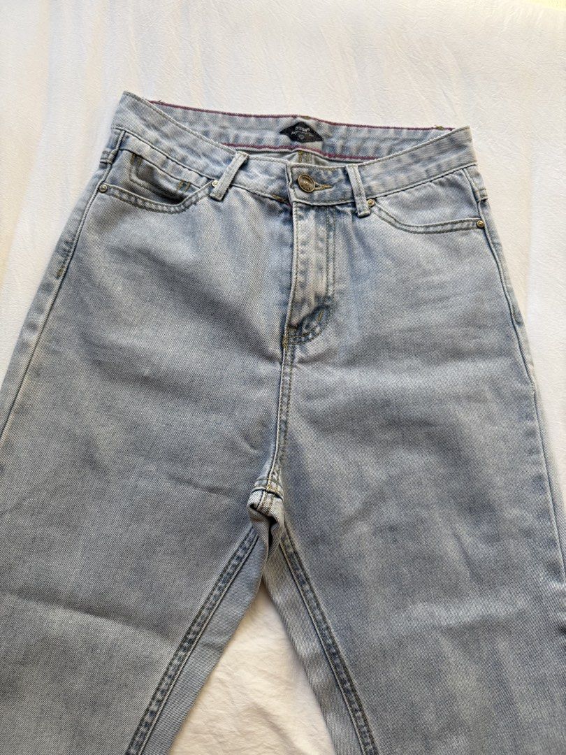 Crissa High Waist Denim Jeans (Category: Jeans) located in Manila. Submitted by the.prelovedcloset (Listing ID 1469254802, Image 1). Description: - Brand: Crissa - Size: Fits 24-26 - Style: High-waist, straight-leg denim - Wash: Light wash with a soft faded effect - Details: Classic five-pocket design, button fly closure, belt loops, and a vintage '1983' tan leather back patch - Condition: Excellent, comfortable fit.
