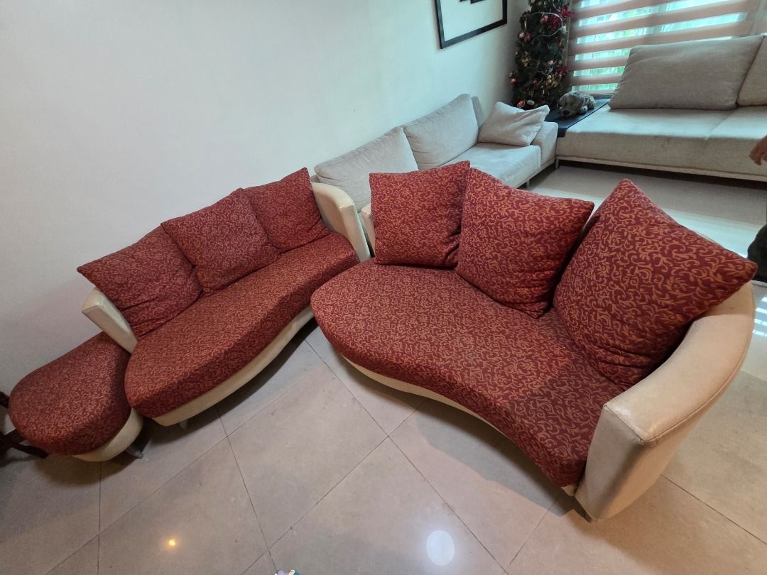 Curved Sofa Set with Red Patterned Cushions and Ottoman (Category: Sofas) located in Taguig. Submitted by maritoni_g (Listing ID 1469182318, Image 3). Description: - Elegant matching curved/modular sofa set featuring intricate red and gold traditional patterns - Bought in Kulala Lumpur, Malaysia - Set includes: 2 large curved sofa (3 seater each), 1 single seater, and 6 backrest scatter cushions - Durable cream leather/vinyl framing along the bas