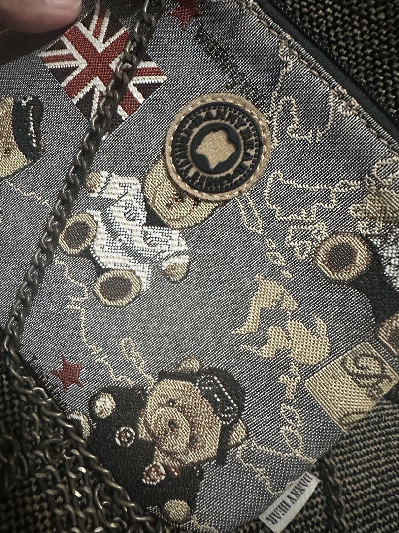 Danny Bear Tapestry Crossbody Bag with Chain Strap (Category: Cross-body Bags) located in Manila. Submitted by shayne2 (Listing ID 1469247287, Image 1). Description: Can fit iphone promax. Preloved good condition - Brand: Danny Bear - Design: Woven tapestry with cute teddy bears, Union Jack flags, and map graphics - Closure: Top zip closure - Strap: Metal chain strap - Interior: Brown fabric lining - Style: Fun vintage aesthetic, great for casual