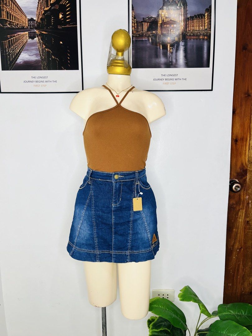 Dark Blue Denim Skort | S 29-30 (Category: Skirts) located in Manila. Submitted by bengirlclothing (Listing ID 1469298890, Image 2). Description: - Color: Dark blue denim with yellow contrast stitching - Style: High waist with front button closure - Comfort: Built-in white shorts underneath for safety - Detail: Small brown leather patch near the bottom hem - Size: Fits waist 29 to 30 inches - Length: 14 inches.