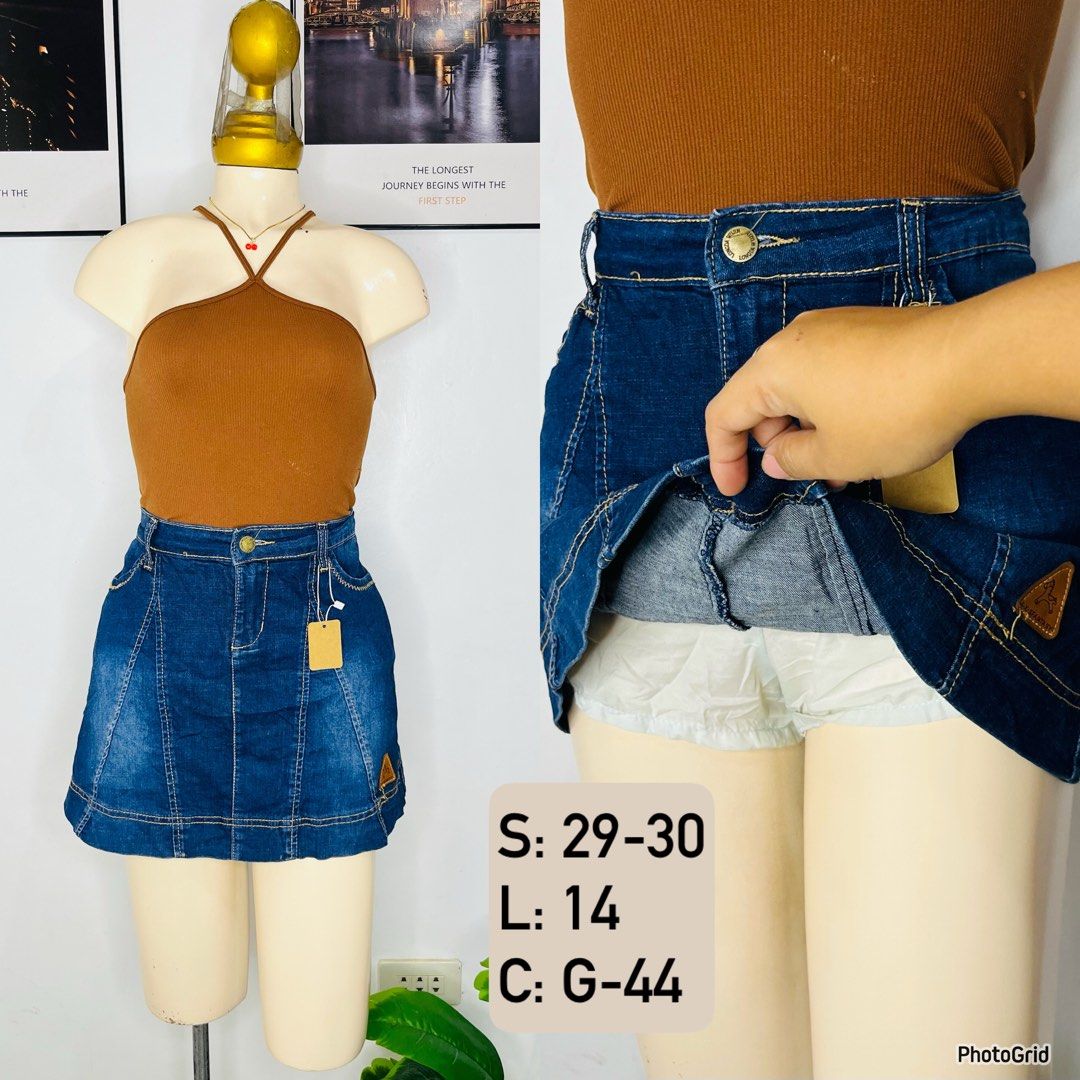 Dark Blue Denim Skort | S 29-30 (Category: Skirts) located in Manila. Submitted by bengirlclothing (Listing ID 1469298890, Image 1). Description: - Color: Dark blue denim with yellow contrast stitching - Style: High waist with front button closure - Comfort: Built-in white shorts underneath for safety - Detail: Small brown leather patch near the bottom hem - Size: Fits waist 29 to 30 inches - Length: 14 inches.