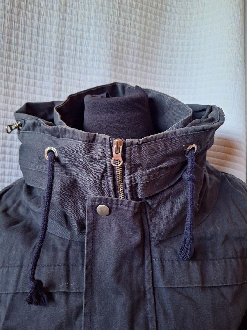 Dark Blue Hooded Casual Bomber Jacket with Drawstrings (Category: Coats, Jackets and Outerwear) located in Balamban. Submitted by ubethan (Listing ID 1469232616, Image 3). Description: - Color: Dark blue - Style: Casual utility jacket - Closure: Front zipper with snap buttons on storm flap - Hood & Collar: High collar with adjustable drawstrings and built-in hood - Pockets: Two slanted front pockets with flap covers - Cuffs & Hem: Ribbed to lock 