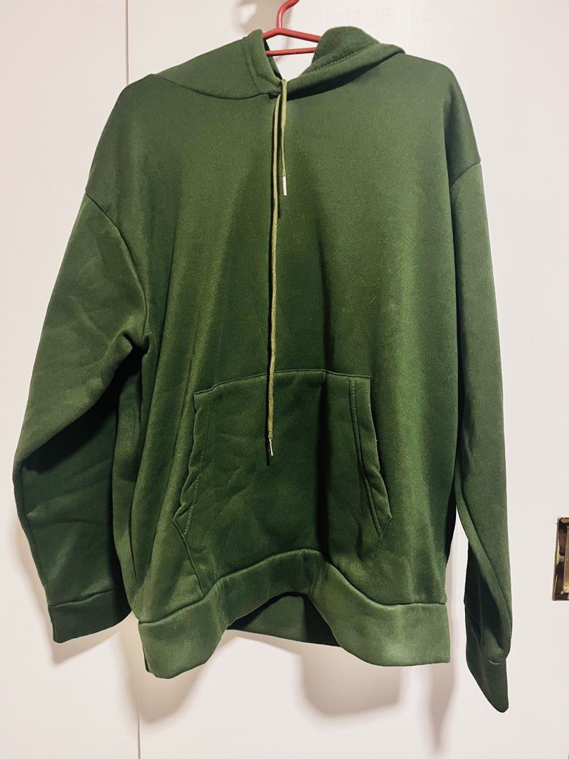Dark Green Hoodie Pullover with Pocket and Drawstrings (Category: Coats, Jackets and Outerwear) located in Paranaque City. Submitted by swiftdragon_cf5b78 (Listing ID 1469335328, Image 1). Description: - Color: Dark green - Fit: Oversized and comfortable - Lining: Soft fleece-lined inside for extra warmth - Features: Big front pocket and long drawstrings - Details: Ribbed cuffs and hem to trap heat - Best for: Cooler weather and casual days.