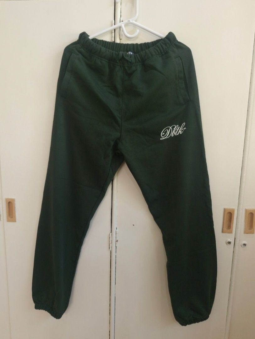 DBTK Dark Green Sweatpants (Category: Joggers) located in Iloilo. Submitted by franzventures (Listing ID 1469188599, Image 1). Description: DBTK Sweat Pants Size: Small - Color: Dark green with white script logo embroidery - Material: Comfortable inner fleece - Features: Elastic waistband, gathered ankle cuffs, and two side pockets - Condition: Brand New 📍Iloilo City.