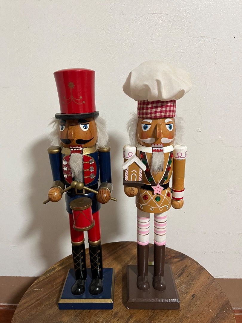 Decorative Christmas Wooden Nutcracker Figurine (Category: Vintage Collectibles) located in Cabuyao City. Submitted by rdtrmt (Listing ID 1469168511, Image 1). Description: - Set of 2 festive wooden nutcrackers for holiday display - Drum Player: Wears a red and blue uniform with a tall hat - Baker: Wears a red-and-white checkered hat, pink striped leggings, and holds a gingerbread house - Hand-painted features accented with small gems and faux fu