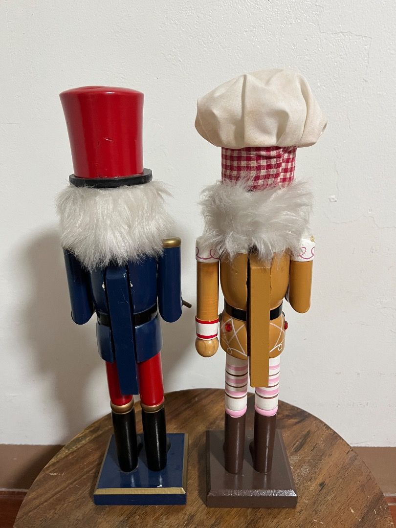 Decorative Christmas Wooden Nutcracker Figurine (Category: Vintage Collectibles) located in Cabuyao City. Submitted by rdtrmt (Listing ID 1469168511, Image 2). Description: - Set of 2 festive wooden nutcrackers for holiday display - Drum Player: Wears a red and blue uniform with a tall hat - Baker: Wears a red-and-white checkered hat, pink striped leggings, and holds a gingerbread house - Hand-painted features accented with small gems and faux fu