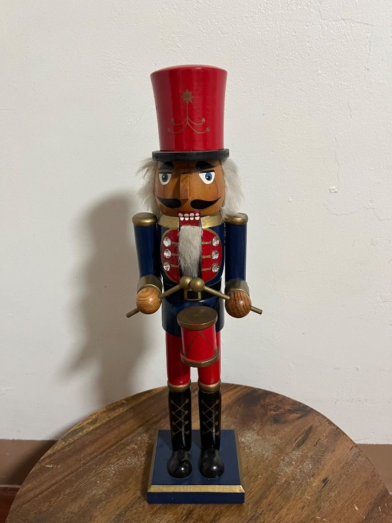 Decorative Christmas Wooden Nutcracker Figurine (Category: Vintage Collectibles) located in Cabuyao City. Submitted by rdtrmt (Listing ID 1469168511, Image 3). Description: - Set of 2 festive wooden nutcrackers for holiday display - Drum Player: Wears a red and blue uniform with a tall hat - Baker: Wears a red-and-white checkered hat, pink striped leggings, and holds a gingerbread house - Hand-painted features accented with small gems and faux fu