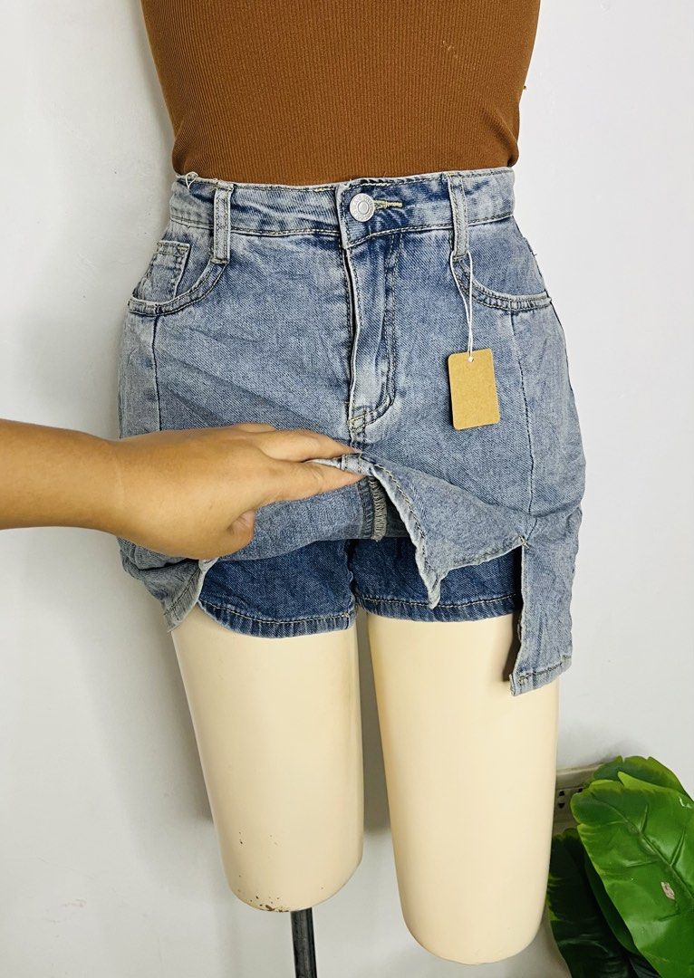 Denim Skort | S 27-29 (Category: Skirts) located in Manila. Submitted by bengirlclothing (Listing ID 1469301661, Image 3). Description: - Style: High waist light wash denim skort with built-in shorts for worry-free wear - Design: Chic front slit on the left, button closure, and functional belt loops - Pockets: Classic front pocket details - Fit/Size: Fits 27" to 29" waist - Length: Approximately 15 inches.