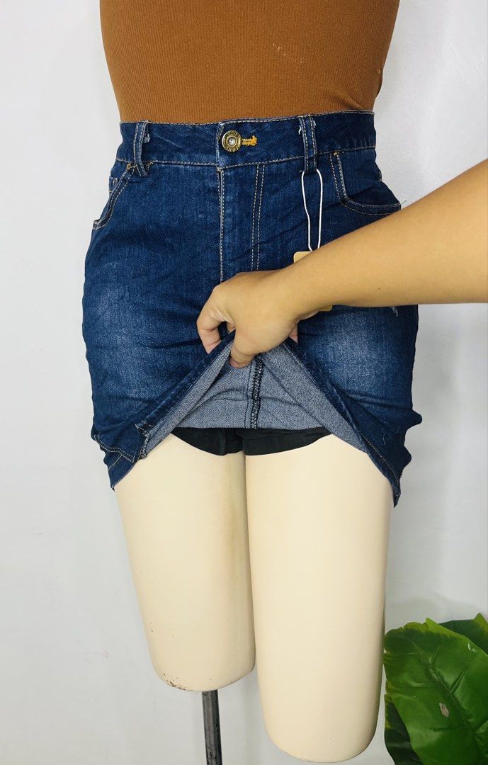 Denim Skort | Size 28-29 (Category: Skirts) located in Manila. Submitted by bengirlclothing (Listing ID 1469306997, Image 3). Description: - Size: Waist 28-29 inches - Length: 17 inches -Design: Dark blue high-waisted denim skirt with contrast yellow stitching and front pockets - Feature: Built-in black shorts underneath for extra coverage and comfort - Closure: Front button and zipper .