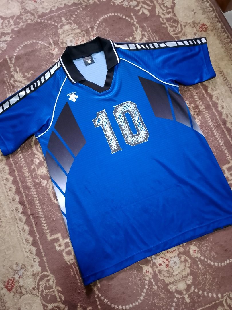 Descente Number 10 Blue Jersey (Category: Activewear) located in Bayombong. Submitted by daily10 (Listing ID 1469168972, Image 2). Description: - Authentic Descente sports jersey (Model DSS-4211, Made in Japan) - Color: Blue with gray side panels and geometric sleeve pattern - Number '10' printed in a stylish sketched design on front and back - Elegant black polo collar accented with white piping - Size: O JASPO (Fits chest 100cm, height 180cm) L