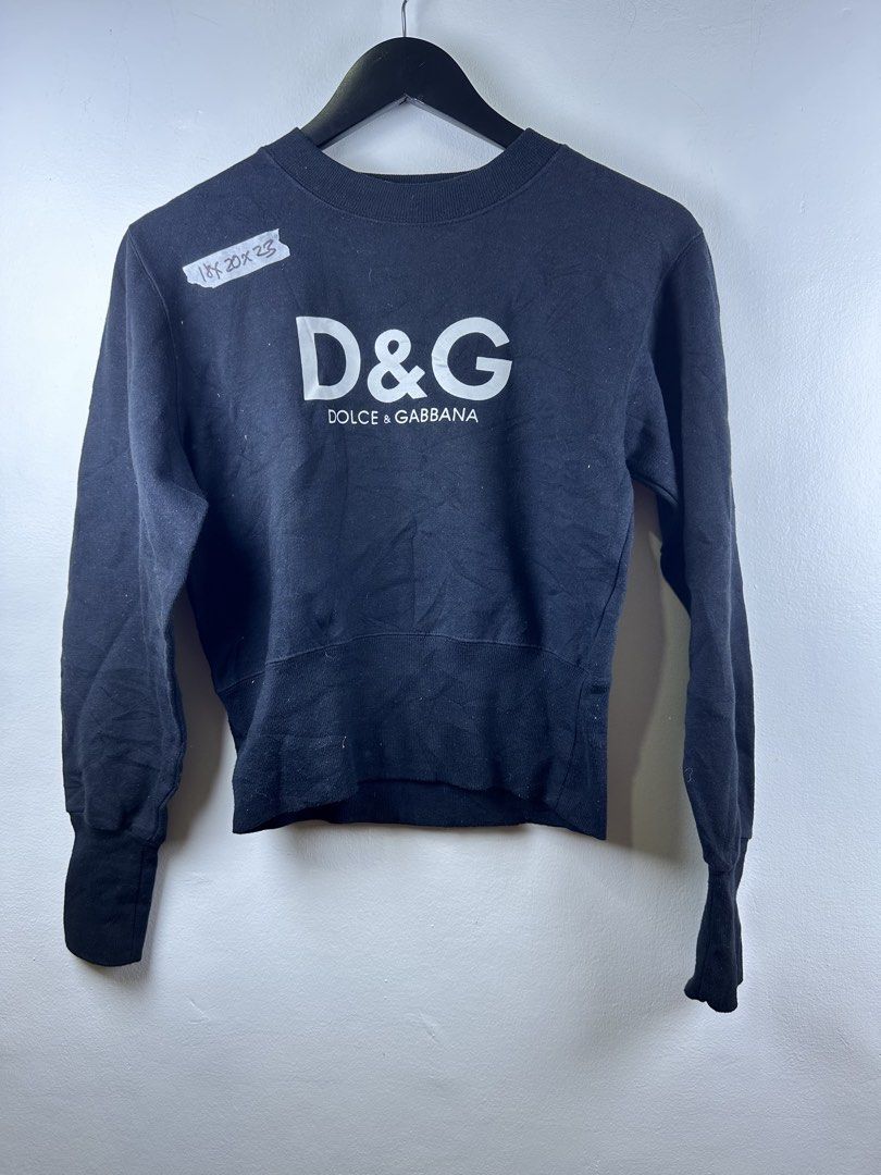 D&G Dolce & Gabbana Black Sweatshirt (Category: Coats, Jackets and Outerwear) located in Manila. Submitted by declutterpromax (Listing ID 1469223231, Image 1). Description: - Brand: D&G Dolce & Gabbana - Color: Classic black - Size/Measurements: Tag shows 18x20x23 inches (fits like a Large) - Design: Bold white logo on the chest, smaller logo detail on upper back - Details: Ribbed crewneck, cuffs, and hem, long sleeves - Material: Soft cotton fab