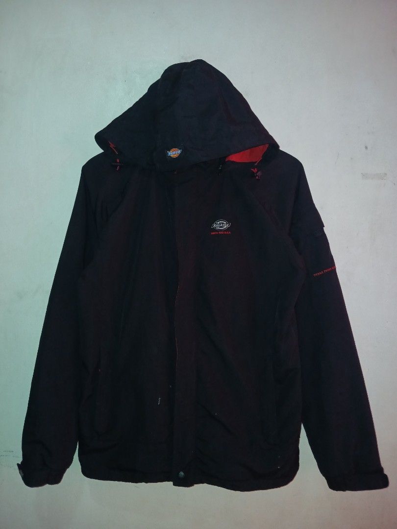 Dickies Black and Red Hooded Winter Jacket (Category: Coats, Jackets and Outerwear) located in Manila. Submitted by ninshok (Listing ID 1469163316, Image 1). Description: - Brand: Dickies - Color: Black with striking red inner lining and branding - Design: Mesh details, zip-up front with snap buttons, and adjustable hood drawstrings - Features: Practical outer pockets and comfortable ribbed cuffs - Fit: Regular fit, great for cold weather - Condi