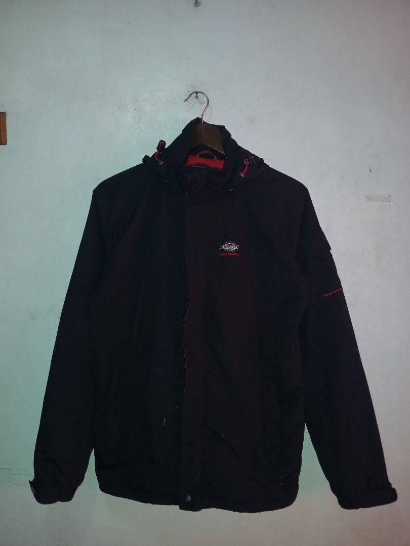 Dickies Black and Red Hooded Winter Jacket (Category: Coats, Jackets and Outerwear) located in Manila. Submitted by ninshok (Listing ID 1469163316, Image 2). Description: - Brand: Dickies - Color: Black with striking red inner lining and branding - Design: Mesh details, zip-up front with snap buttons, and adjustable hood drawstrings - Features: Practical outer pockets and comfortable ribbed cuffs - Fit: Regular fit, great for cold weather - Condi