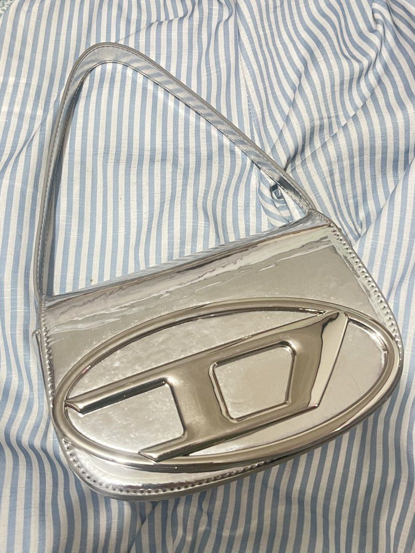 Diesel Silver Metallic Shoulder Bag (Category: Shoulder Bags) located in Rizal. Submitted by cwassnut (Listing ID 1469164428, Image 1). Description: Diesel Silver Bag - long strap included - dm for more pics and infos - mop: bdo online transfer - rfs: decluttering.